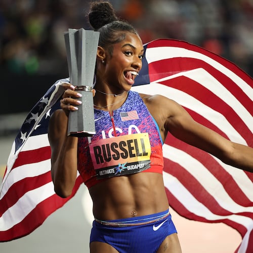 Masai Russell, of the United States, celebrates winning the women's 100 meters hurdles final during the World Athletics Ultimate Championship in Budapest, Hungary, Friday, Sept. 11, 2026. (AP Photo/Armin Durgut)