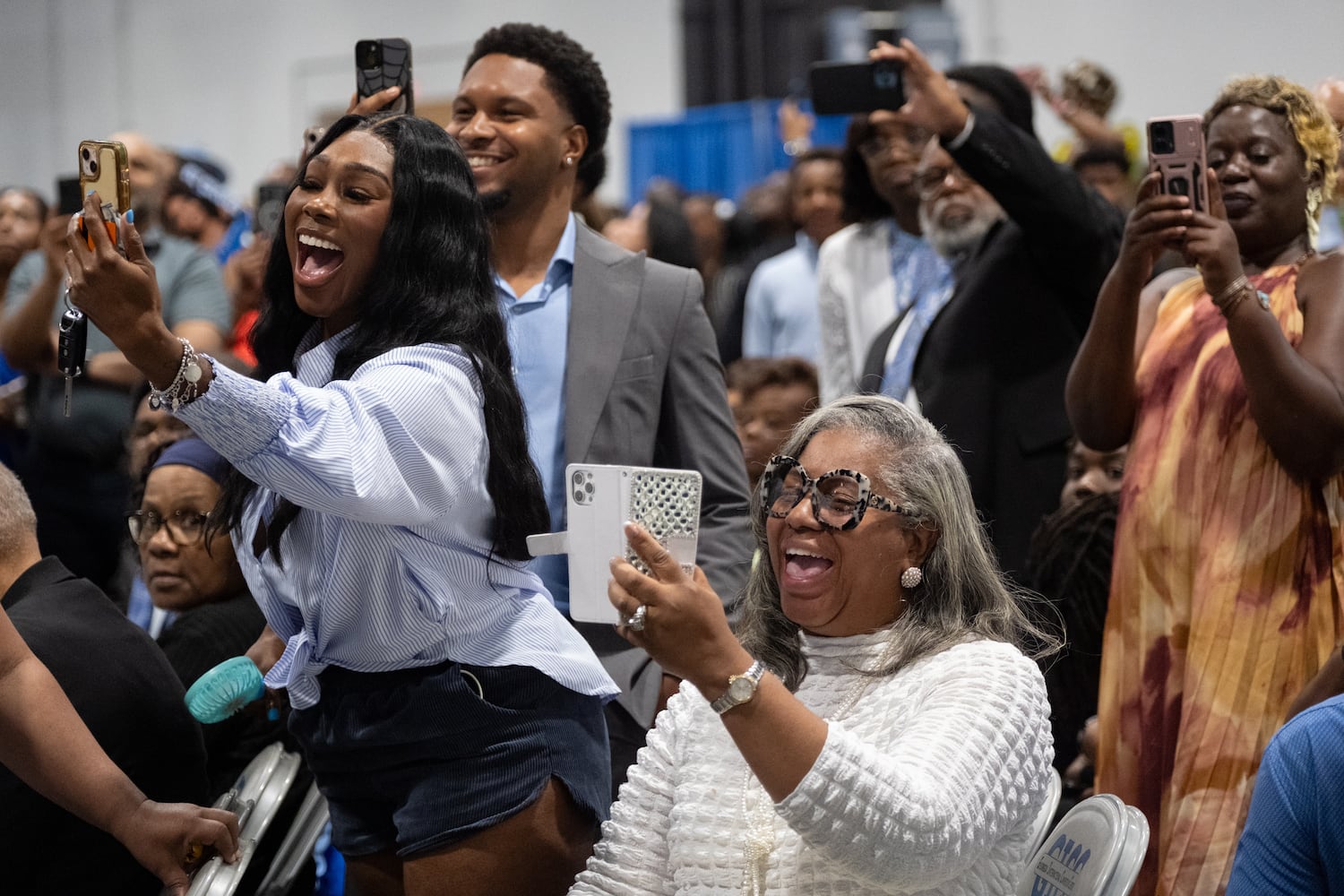People look for their graduates during the procession at the Spelman College graduation ceremony at the Georgia International Convention Center in College Park on Sunday, May 18, 2025.   Ben Gray for the Atlanta Journal-Constitution