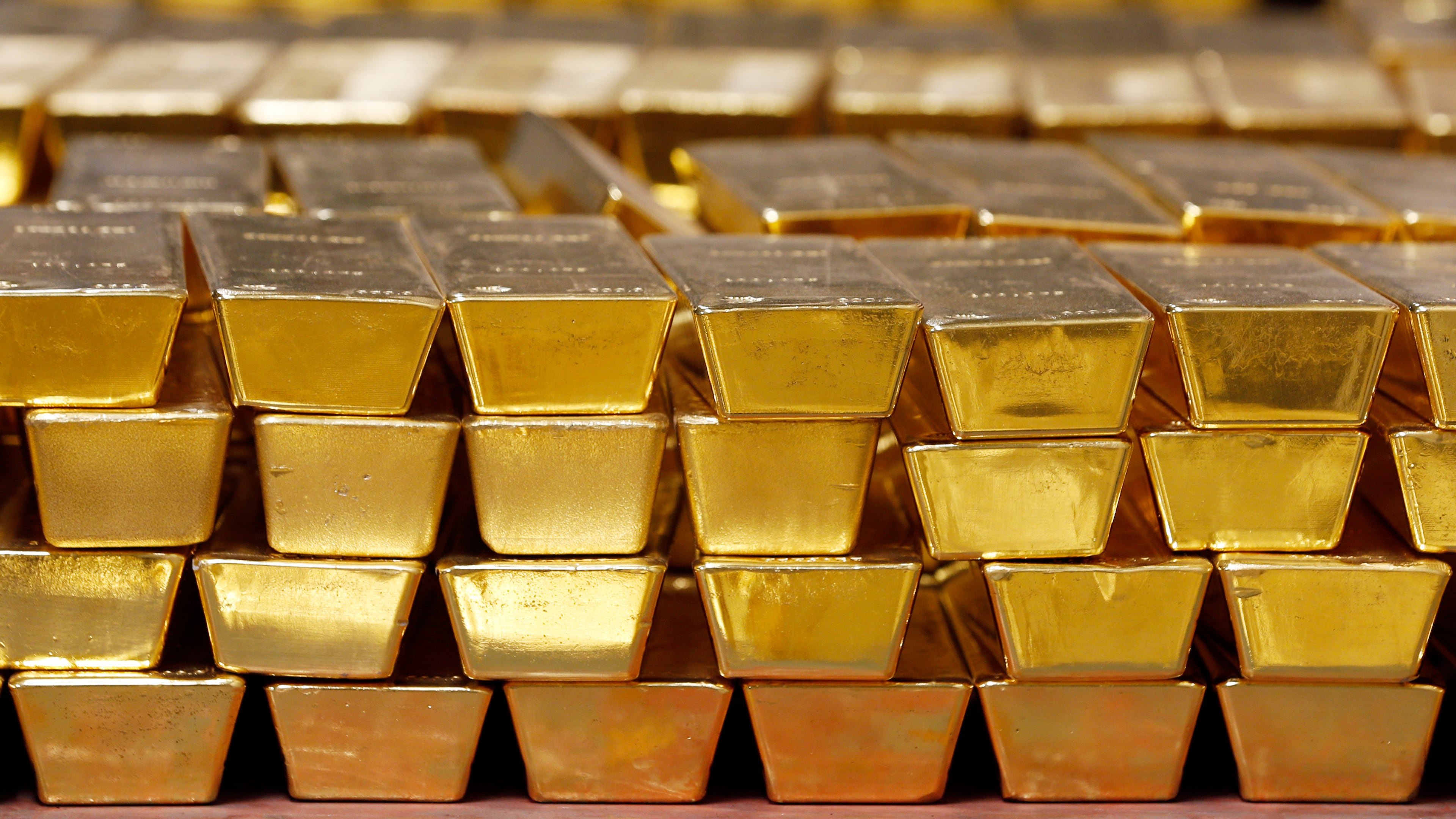 FILE - Gold bars are stacked in a vault at the United States Mint on July 22, 2014, in West Point, N.Y. (AP Photo/Mike Groll, File)