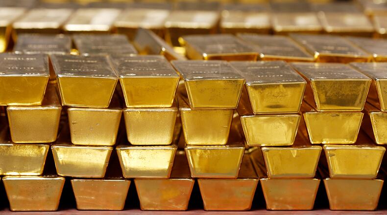 FILE - Gold bars are stacked in a vault at the United States Mint on July 22, 2014, in West Point, N.Y. (AP Photo/Mike Groll, File)