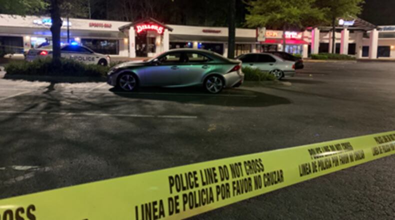 Gwinnett County police are investigating a deadly shooting at a shopping center near Ronald Reagan Parkway on Sunday. April 6, 2024.