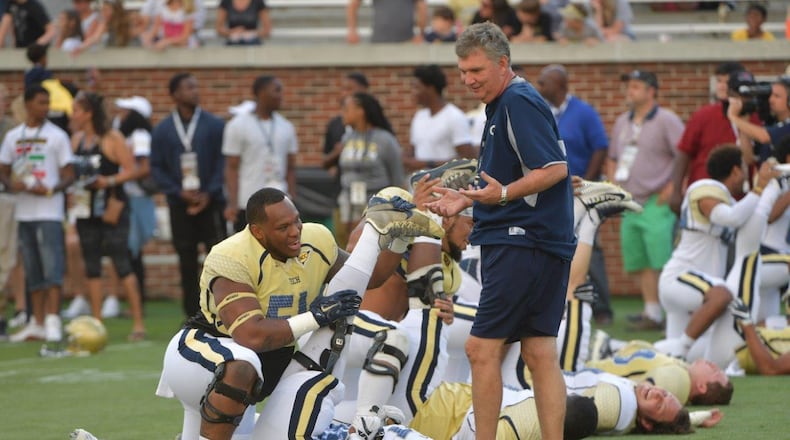 Georgia Tech Yellow Jackets head coach Paul Johnson chats with Georgia Tech Yellow Jackets defensive tackle Kyle Cerge-Henderson (54) as he warms up with teammates before 2017 Georgia Tech Football Spring Game at Bobby Dodd Stadium on Friday, April 21, 2017. HYOSUB SHIN / HSHIN@AJC.COM