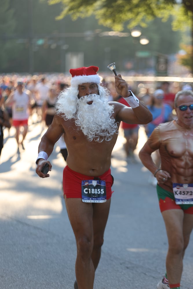 Santa leaves the North Pole for the 56th running of the AJC Peachtree Road Race on Friday, July 4, 2025, in Atlanta. (Arvin Temkar/AJC)