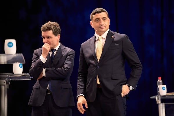 FILE - Presidential candidates Nicusor Dan, left, and George Simion take a break during a live electoral debate ahead of the second round of the country's presidential election redo in Bucharest, Romania, Thursday night, May 8, 2025. (AP Photo/Vadim Ghirda, File)