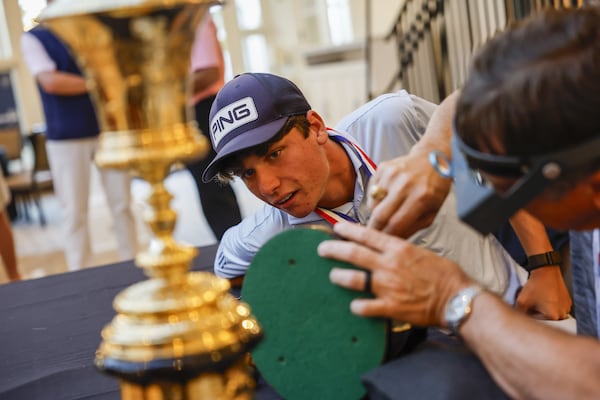 Mason Howell watches as his name is engraved on the Havemeyer Trophy following the finals of the 2025 U.S. Amateur on Sunday, Aug. 17, 2025, in San Francisco. (Chris Keane/USGA)