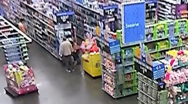 Surveillance footage from an Acworth Walmart shows Mahendra Patel interacting with a shopper who later accused him of trying to snatch her son. The man's attorney says the video contradicts the police department's version of events. (Handout)