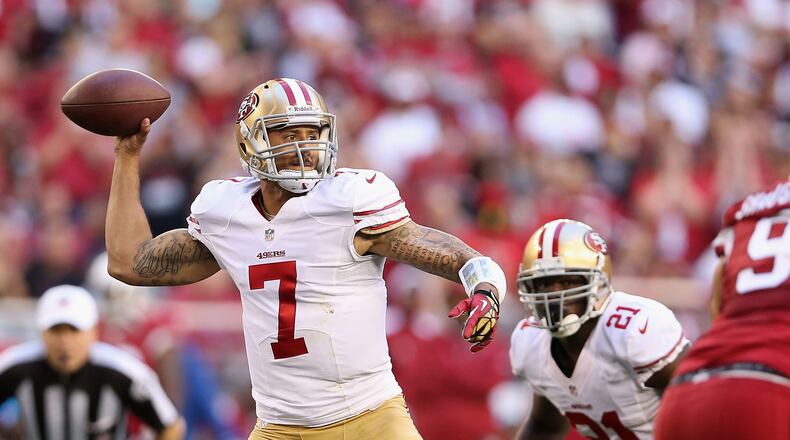 GLENDALE, AZ - DECEMBER 29:  Quarterback Colin Kaepernick #7 of the San Francisco 49ers throws a pass during the NFL game against the Arizona Cardinals at the University of Phoenix Stadium on December 29, 2013 in Glendale, Arizona.  The 49ers defeated the Cardinals 23-20.  (Photo by Christian Petersen/Getty Images)