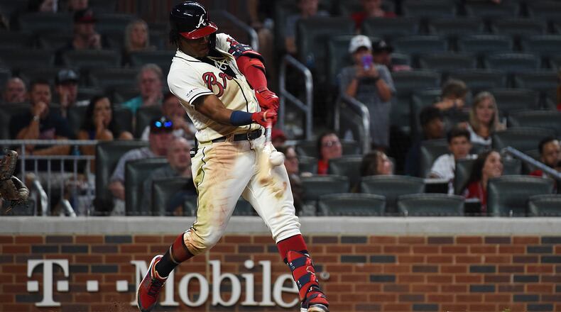 Ronald Acuna Jr. #13 of the Atlanta Braves hits a home run in the 8th inning against the Washington Nationals at SunTrust Park on July 21, 2019 in Atlanta, Georgia. (Photo by Logan Riely/Getty Images)