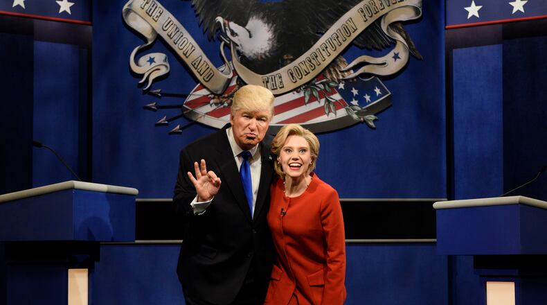 In this photo provided by NBC, Alec Baldwin, left, as Republican presidential candidate, Donald Trump, and Kate McKinnon, as Democratic presidential candidate, Hillary Clinton, perform during the "Debate Cold Open" sketch on the 42nd season of "Saturday Night Live," in New York, Saturday, Oct. 1, 2016. (Will Heath/NBC via AP)