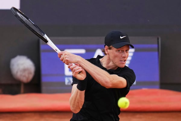 Jannik Sinner of Italy, returns to Carlos Alcaraz of Spain during their final tennis match in the Italian Open at the Foro Italico in Rome, Sunday, May 18, 2025. (AP Photo/Andrew Medichini)