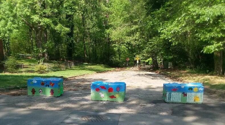 Colorful barriers off River Road in south DeKalb County block a former illegal dump site. Photo: DeKalb County