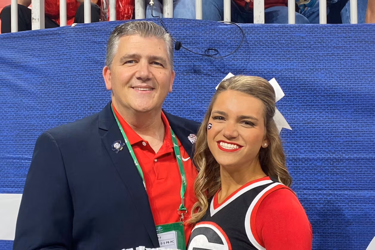 David Epps (left) — pictured with his daughter, Maggie, when she was a cheerleader for Georgia — will take over as CEO of the Peach Bowl after the retirement of Gary Stokan. (Courtesy)