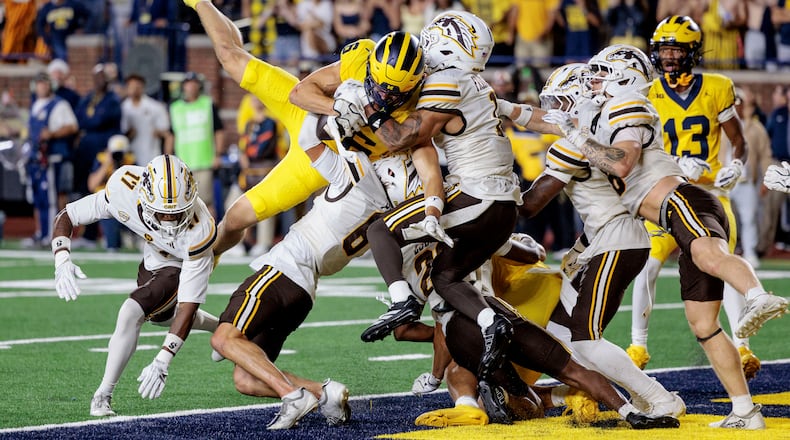 Michigan's wide receiver JJ Buchanan (6) makes the game-winning catch to win over Western Michigan with a last-second touchdown during an NCAA college football game in Ann Arbor, Mich., Saturday, Sept. 5 2026. (Jacob Hamilton/Ann Arbor News via AP)