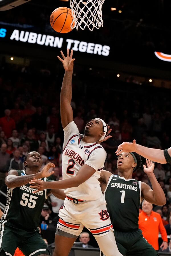 Auburn guard Denver Jones (2) shoots against Michigan State during the second half in the Elite Eight of the NCAA college basketball tournament, Sunday, March 30, 2025, in Atlanta. (AP Photo/Brynn Anderson)