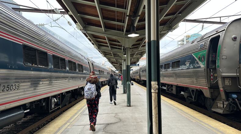 FILE - People walk through Union Station on March 27, 2026, in Washington. (AP Photo/Bill Barrow, File)