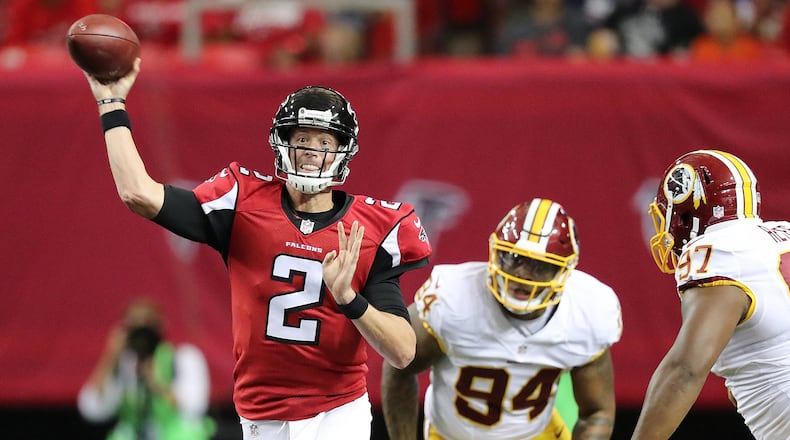 081116 ATLANTA: Falcons quarterback Matt Ryan throws an incomplete pass under pressure from Redskins linebacker Preston Smith to go three and out during the first quarter in an NFL preseason football game on Thursday, August 11, 2016, in Atlanta. Curtis Compton /ccompton@ajc.com