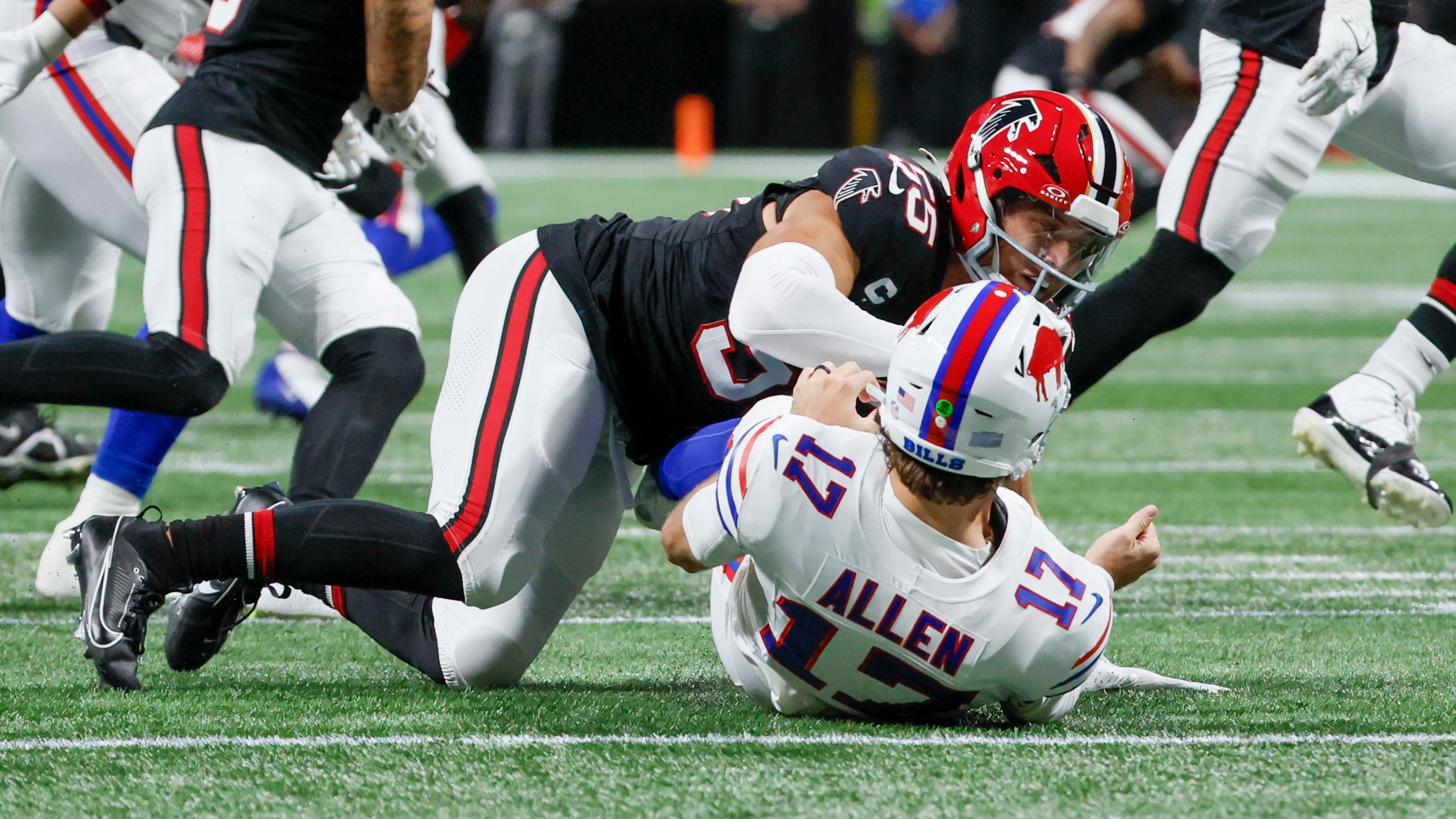 Atlanta Falcons linebacker Kaden Elliss (55) tackles Buffalo Bills quarterback Josh Allen (17) after a pass during the first half of an NFL football game against the Buffalo Bills at Mercedes-Benz Stadium in Atlanta on Monday, October 13, 2025.
(Miguel Martinez/ AJC)