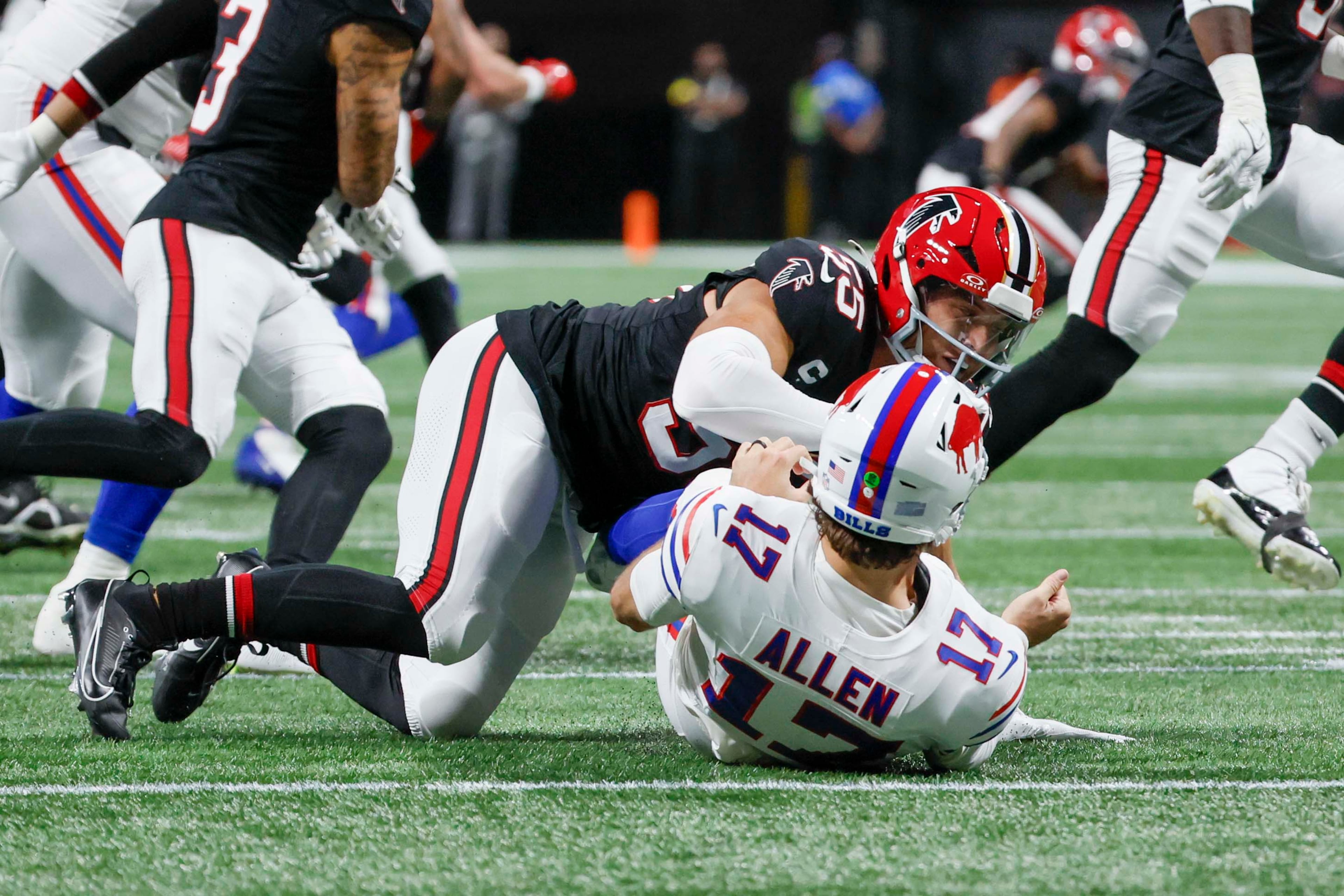 Atlanta Falcons linebacker Kaden Elliss tackles Buffalo Bills quarterback Josh Allen after a pass during the first half of an NFL football game against the Buffalo Bills at Mercedes-Benz Stadium in Atlanta on Monday, October 13, 2025. (Miguel Martinez/AJC)