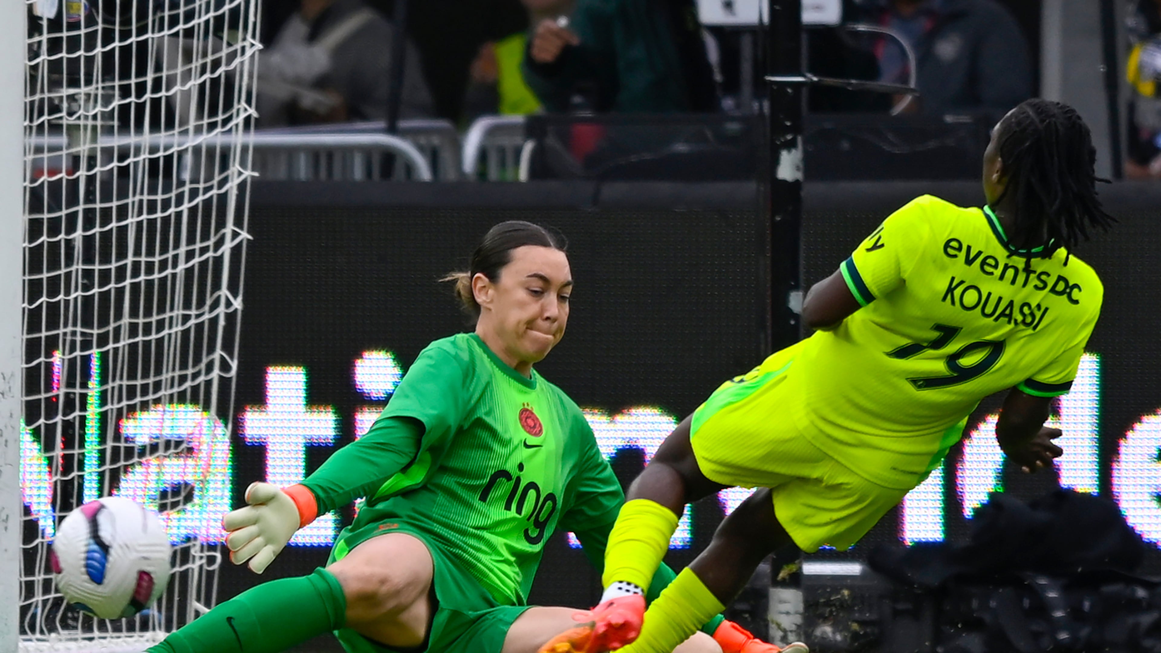 Washington Spirit forward Rosemonde Kouassi (19) plays the ball past Portland Thorns FC goalkeeper Mackenzie Arnold where teammate Gift Monday scored a goal during the first half of a NWSL semifinal women's soccer match, Saturday, Nov. 15, 2025, in Washington. (AP Photo/John McDonnell)