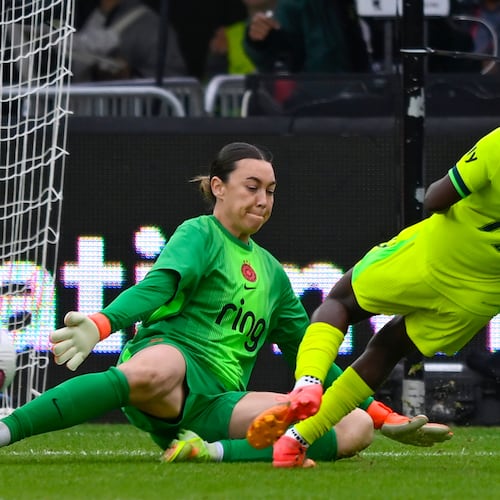 Washington Spirit forward Rosemonde Kouassi (19) plays the ball past Portland Thorns FC goalkeeper Mackenzie Arnold where teammate Gift Monday scored a goal during the first half of a NWSL semifinal women's soccer match, Saturday, Nov. 15, 2025, in Washington. (AP Photo/John McDonnell)