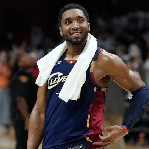Cleveland Cavaliers guard Donovan Mitchell (45) smiles as fans cheer while he is interviewed after the Cavaliers defeated the Detroit Pistons in Game 3 of a second-round NBA playoffs basketball series Saturday, May 9, 2026 in Cleveland. (AP Photo/Sue Ogrocki)