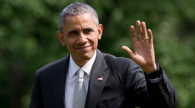 President Barack Obama waves as he walks from Marine One as he arrives on the South Lawn of the White House in Washington, Sunday, May 15, 2016, after speaking at Rutgers University's 250th Anniversary commencement ceremony. (AP Photo/Carolyn Kaster)