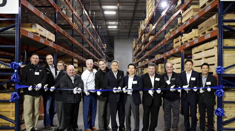 Doosan Infracore North America LLC officials cut a ribbon to officially open their new parts distribution center in Suwanee. The facility will serve Doosan equipment dealers and customers in the U.S. and Canada. Paige Peterson Photo