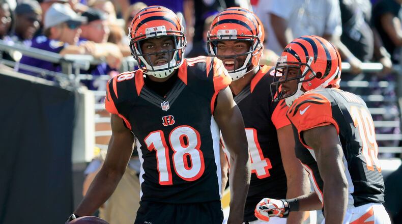 Cincinnati wide receiver A.J. Green is congratulated by teammates after Green's late fourth quarter touchdown during against the Baltimore Ravens at M&T Bank Stadium on September 7, 2014 in Baltimore.