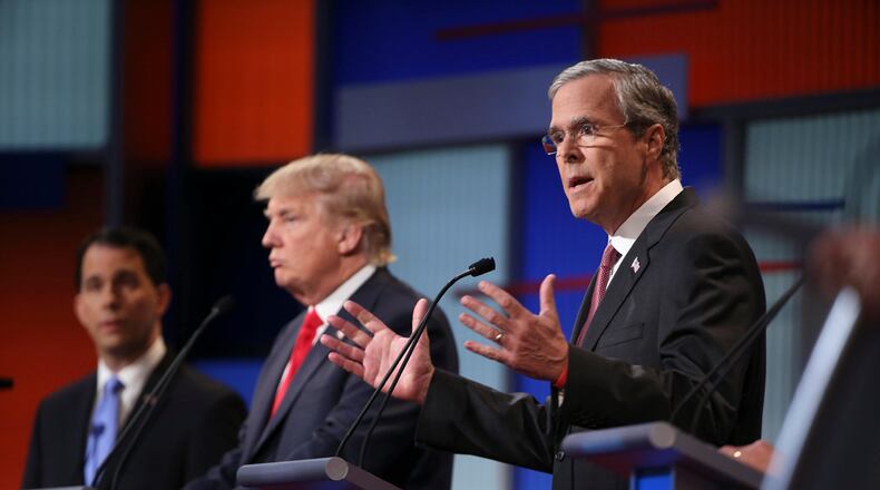 Jeb Bush, right, and Donald Trump at the Republican presidential debate hosted by Fox News in Cleveland, Aug. 6. After failing to directly confront Trump in the first debate, Bush and his aides are under pressure to create a memorable showdown Wednesday to match a newly aggressive tone on the campaign trail.