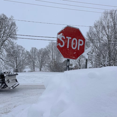 A driver navigates fresh snowfall in Lowville, New York, on Friday, Jan. 23, 2026. (AP Photo/Cara Anna)