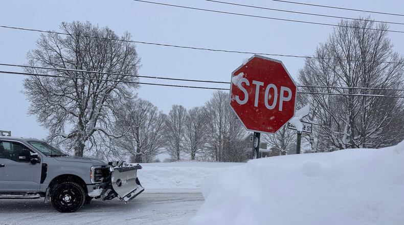 A driver navigates fresh snowfall in Lowville, New York, on Friday, Jan. 23, 2026. (AP Photo/Cara Anna)