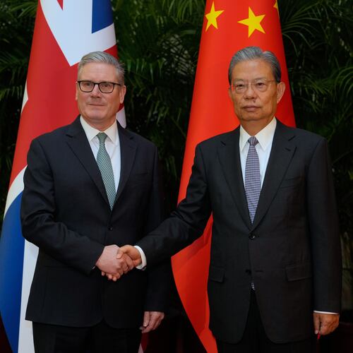 Britain's Prime Minister Keir Starmer, left shakes hands with National People's Congress Chairman Zhao Leji at the Great Hall of the People in Beijing, China, Thursday, Jan. 29, 2026. (AP Photo/Kin Cheung, Pool)
