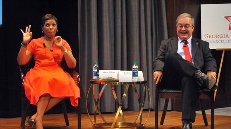 AUGUST 19, 2014 ATLANTA Richard Woods smiles as his opponent, Valarie Wilson, signals OK to the timekeeper during the forum. Democrat Valarie Wilson and Republican Richard L. Woods, the two candidates in the race for state superintendent of schools, participate in a candidate forum at the Georgia Pacific auditorium Tuesday, August 19, 2014. Education issues like Common Core, Race to the Top and school district funding were discussed during the forum as questions were asked from panelists and members of the audience. KENT D. JOHNSON / KDJOHNSON@AJC.COM The two candidates for state school superintendent, Valarie Wilson and Richard Woods, have different takes on how teachers view Common Core. (AJC Photo)