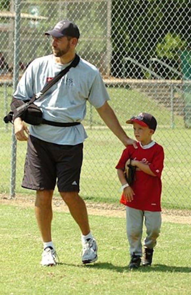 Smoltz coaches young fans at baseball camp