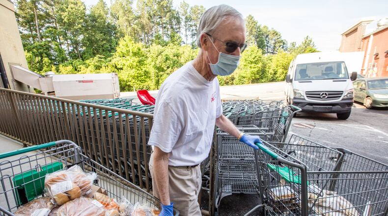 Ned Cone volunteers with Second Helping Atlanta, picking up food at Sprouts in Smyrna that is nearing its sell-by date and transporting it to the Atlanta Mission on Tuesday, June 2, 2020. (Jenni Girtman for The Atlanta Journal-Constitution)