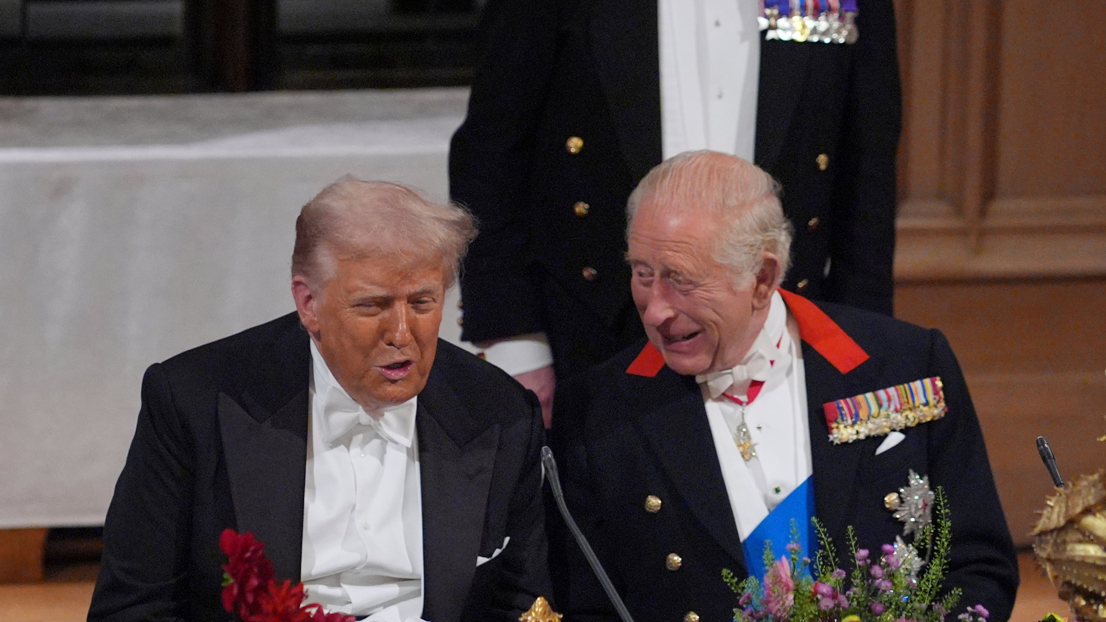 U.S. President Donald Trump, left, and Britain's King Charles speak during the State Banquet in Windsor Castle, England, on day one of U.S. President Donald Trump and First Lady Melania Trump's second state visit to the UK, Wednesday Sept. 17, 2025. (Yui Mok/PA via AP, Pool Photo via AP)