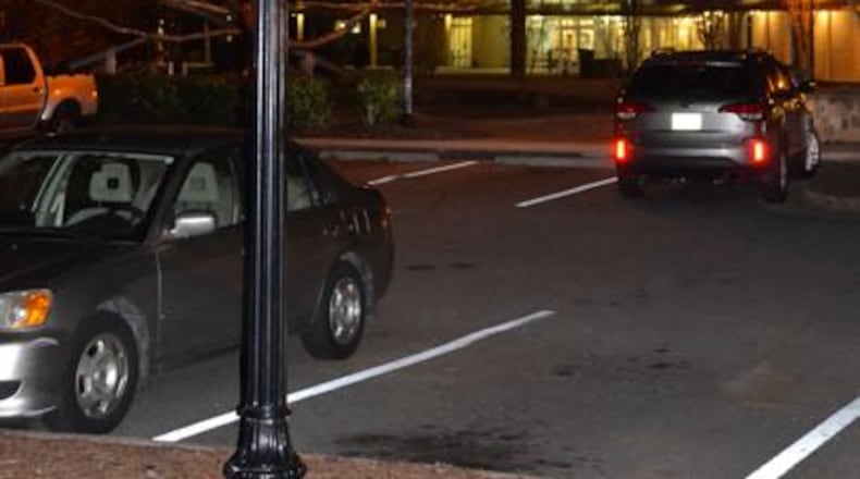 A white LED street light outside City Hall in Peachtree City shows the difference between the conventional yellow bulbs and newer, more energy-efficient bulbs. Photo by Jill Howard Church for the AJC