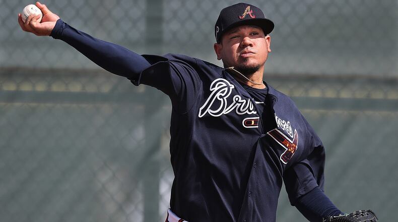 Braves pitcher Felix Hernandez delivers a pitch working from the mound during the first workout at spring training on Thursday, Feb. 13, 2020, in North Port, Fla.  Curtis Compton ccompton@ajc.com