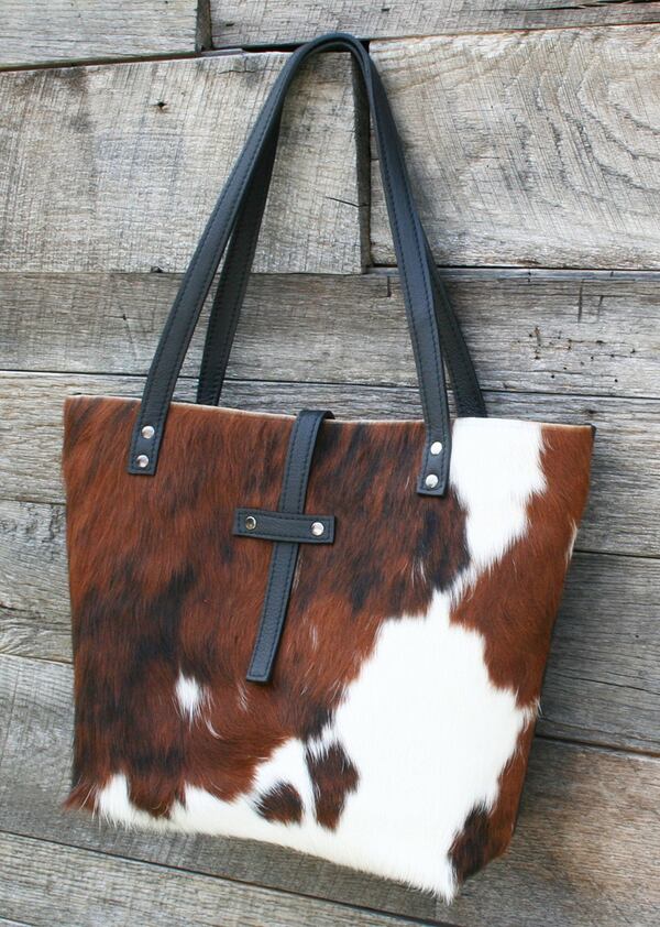 For casual sophistication, Canton-based Beaudin Designs offers its tricolor, hair-on hide tote. But anything with cowhide fur, including the wallets, are hot sellers. CONTRIBUTED BY BEAUDINDESIGNS.COM