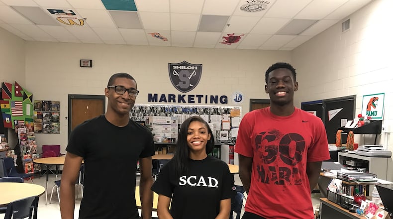 Shiloh High School seniors De'Onta Alston, Ayanna Gash and Isreal Koker-Thomas are among the first class of students to complete its International Baccalaureate Career-Related Programme. ERIC STIRGUS / ESTIRGUS@AJC.COM