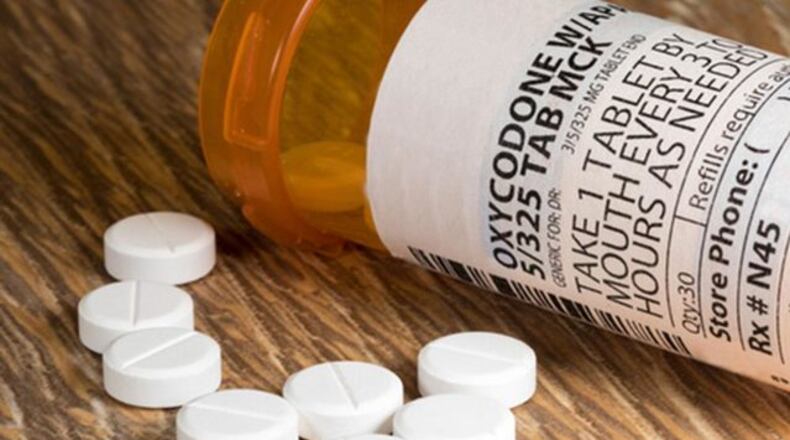 <p>One estimate says the nationwide economic toll from the opioid epidemic topped $1 trillion over the last 17 years. (Photo via The Atlanta Journal-Constitution)</p>