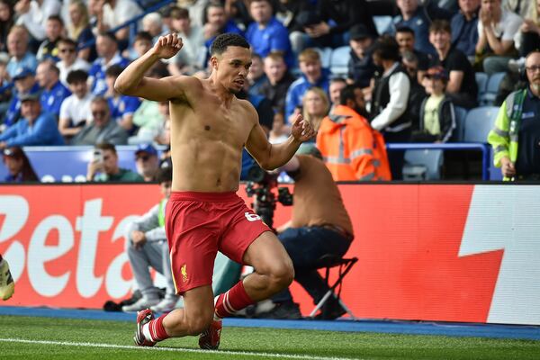 Liverpool's Trent Alexander-Arnold celebrates after scoring his side's opening goal during the English Premier League soccer match between Leicester City and Liverpool at King Power stadium in Leicester, England, Sunday, April 20, 2025. (AP Photo/Rui Vieira)