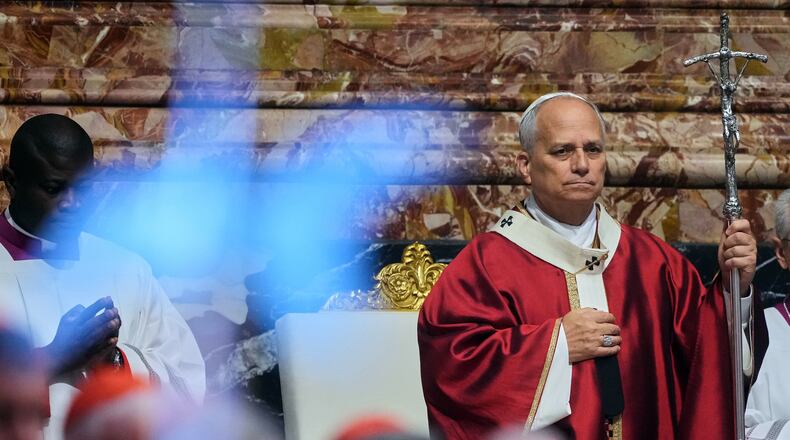 FILE - Pope Leo XIV arrives in St. Peter's Basilica at the Vatican for Mass for the repose of the soul of the late Pope Francis and deceased cardinals, Monday, Nov. 3, 2025. (AP Photo/Andrew Medichini), File)