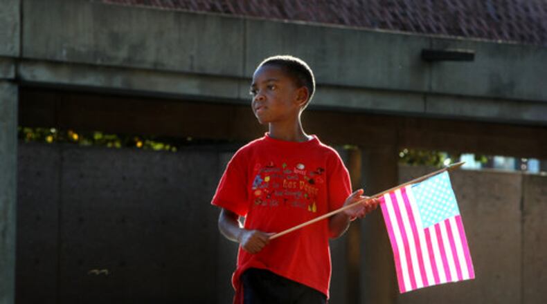 4:01 p.m. Atlanta: Ezekiel Thompson, 5, brought an American flag to the crypt of Martin Luther King Jr. and Coretta Scott King on Tuesday.