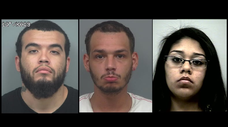 (from left) Marlon Torres, Juan Johnny Marrero and Iris Lizeth Torres have each been charged with 13 counts of identity fraud and 13 counts of computer invasion of privacy.