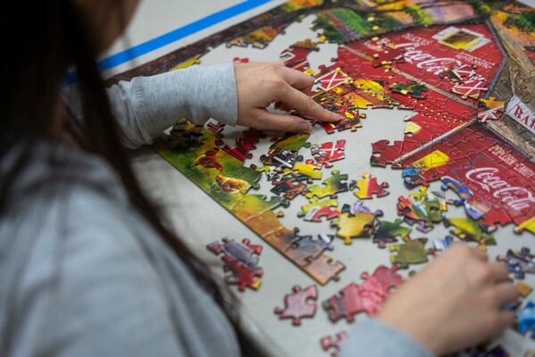 Jessica Yin competes in the solo round at the Georgia Speed Puzzling Championship. (Olivia Bowdoin for the AJC)