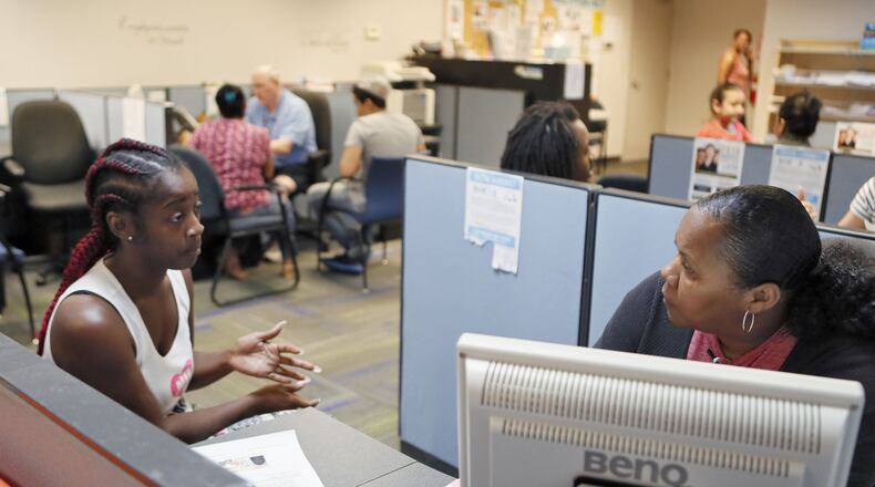 Dennishia Davis (left), who came for assistance after being evicted, is interviewed by Nicole Cornish in the intake area of the Norcross Cooperative Ministry on July 13, 2018. Gwinnett County has as big of a homeless problem as any community in metro Atlanta and has allocated $500,000 in this year’s budget to address the issue. BOB ANDRES /BANDRES@AJC.COM