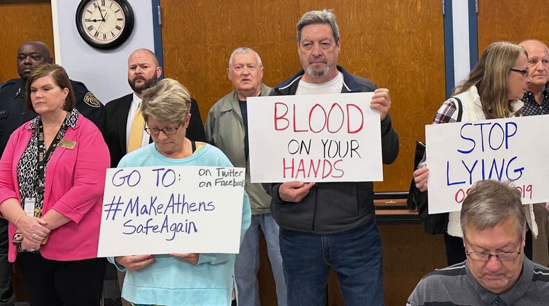 Around a dozen demonstrators were present as Athens-Clarke County Mayor Kelly Girtz spoke at a press conference on Wednesday, Feb. 28, 2024. The demonstrators held signs that read “blood on your hands” and “justice for Laken. (Fletcher Page Fletcher.Page@ajc.com)