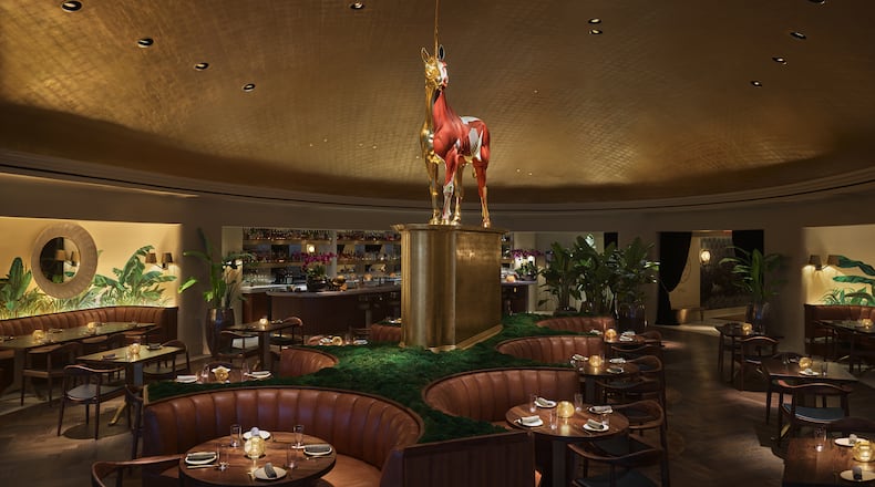 A striking unicorn sculpture by English artist Damien Hirst looms above the dining room at Pao in Miami Beach’s Faena Hotel. PHOTO: Courtesy of Nik Koenig, Faena Hotel Miami Beach.