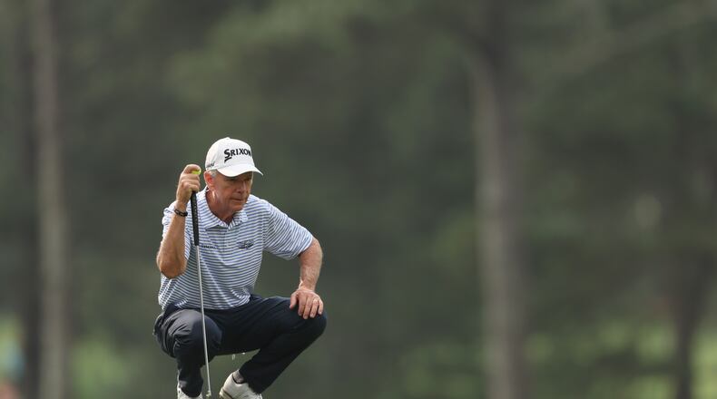 Larry Mize lines up putt on third hole during first round of the 2023 Masters Tournament at Augusta National Golf Club, Thursday, April 6, 2023, in Augusta, Ga. (Jason Getz / Jason.Getz@ajc.com)